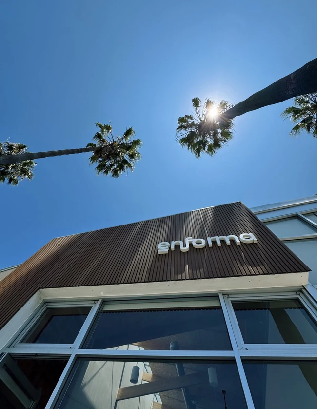 Enforma's Abbot Kinney storefront beneath Venice palm trees